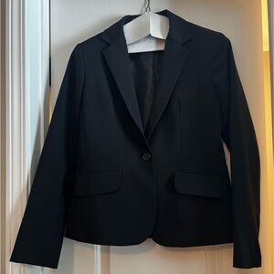 Woman’s suit jacket and skirt. Size 4